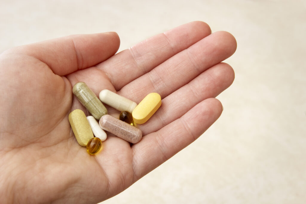 A handful of vitamins, minerals and dietary supplements.